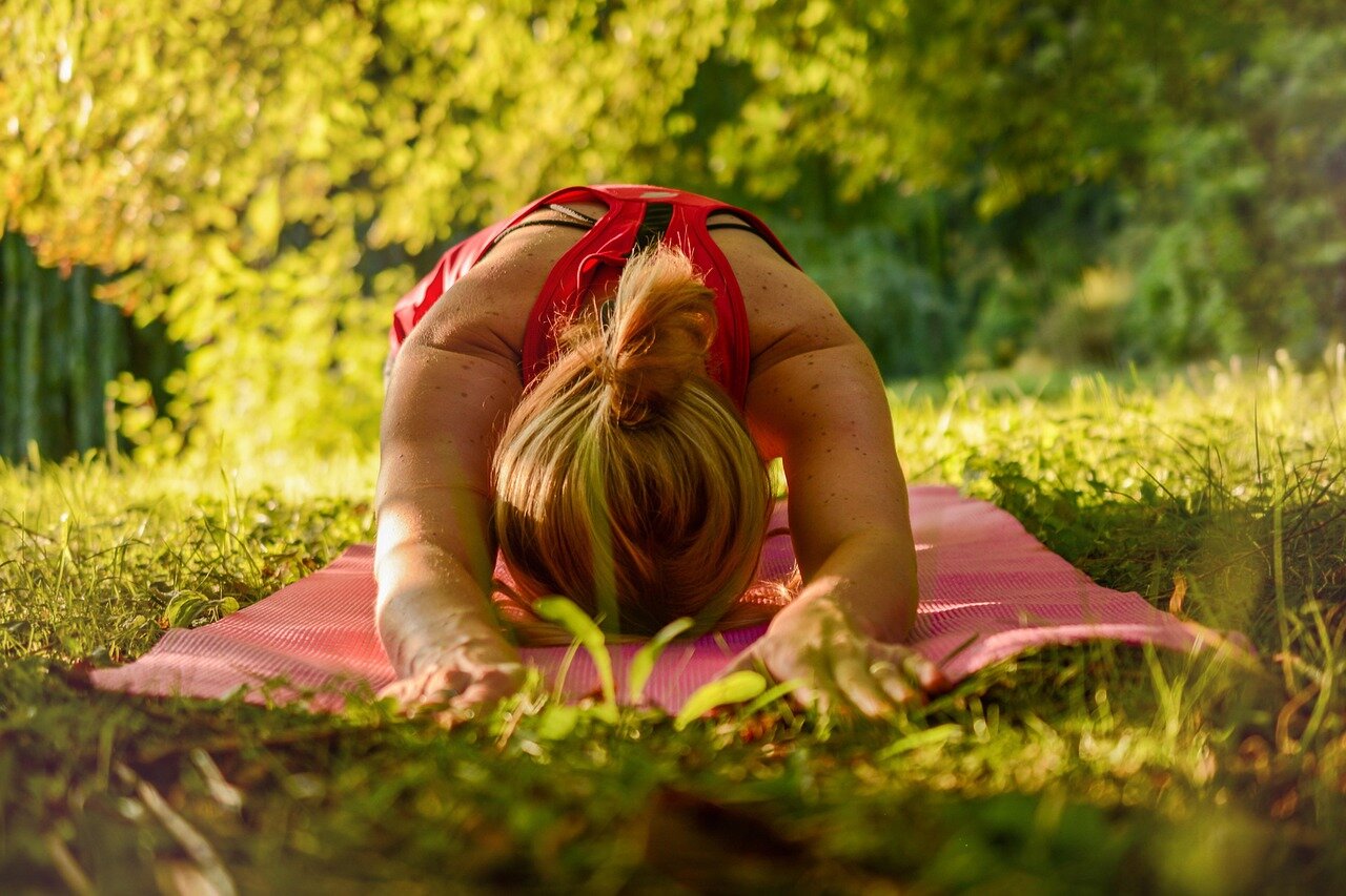 Active senior woman stretching outdoors enjoying healthy joint mobility and flexibility